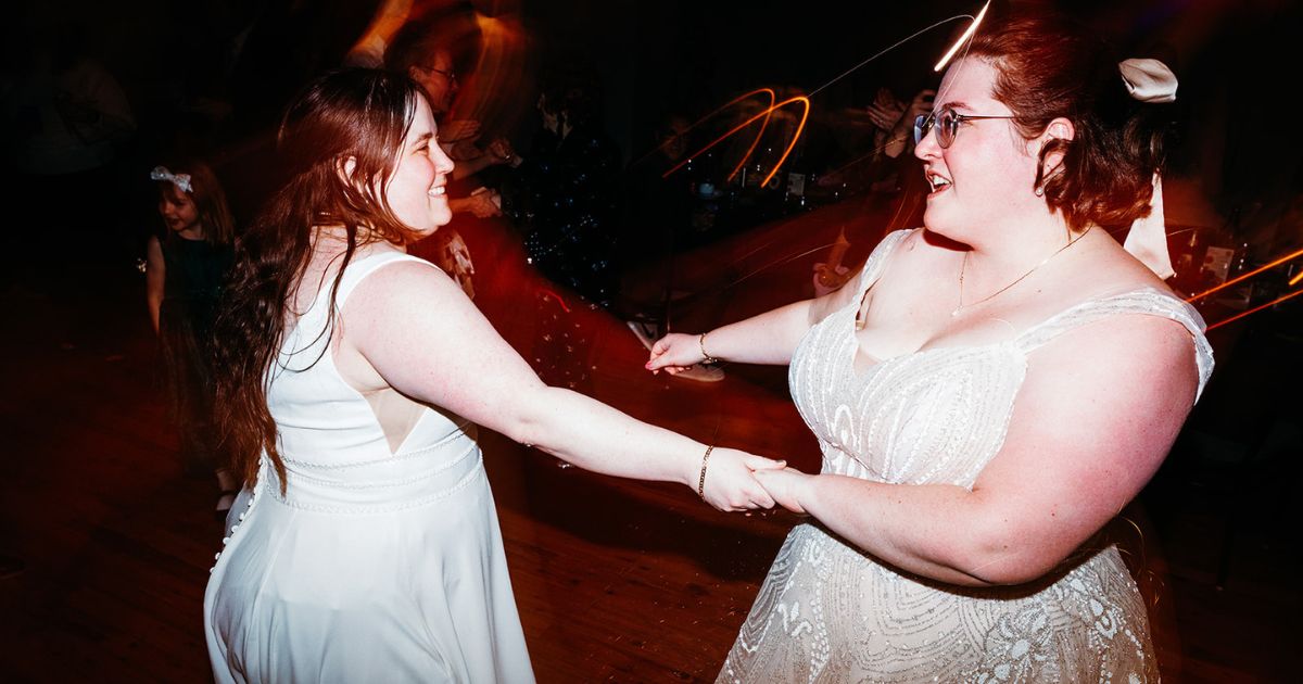 Brides dancing at DC Pinstripes wedding reception