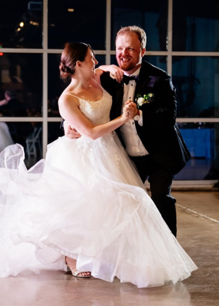 a couple has their first dance at the baltimore museum of industry