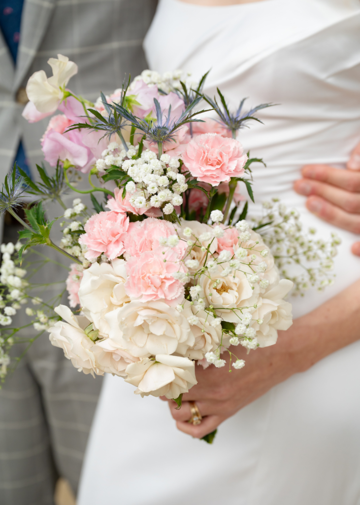 a bride's wedding bouquet with pink and white flowers