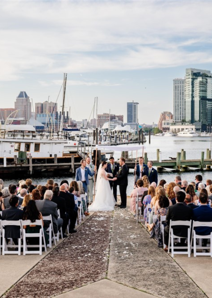 wedding ceremony with a water view at the baltimore musuem of industry