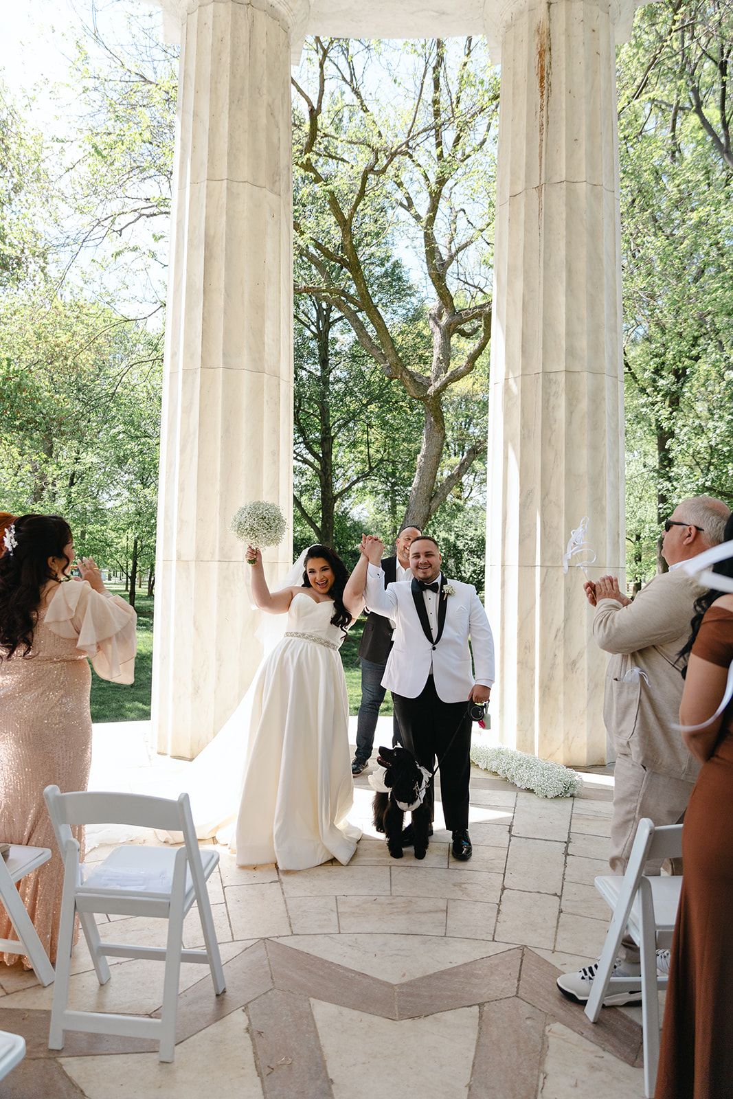 Washington, DC War Memorial wedding couple celebrating after saying "I do."