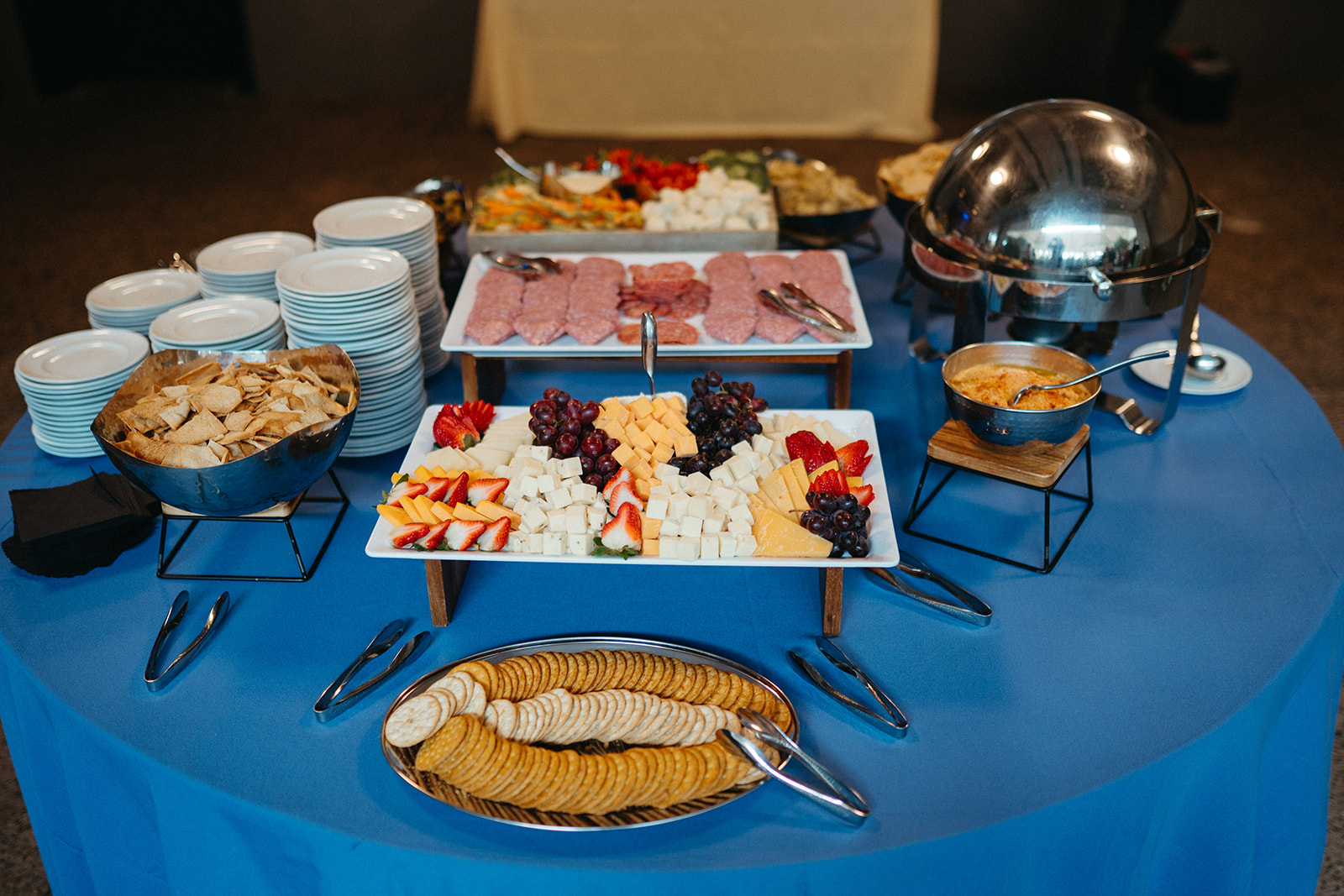 spread of food on table including crackers and other small snacks