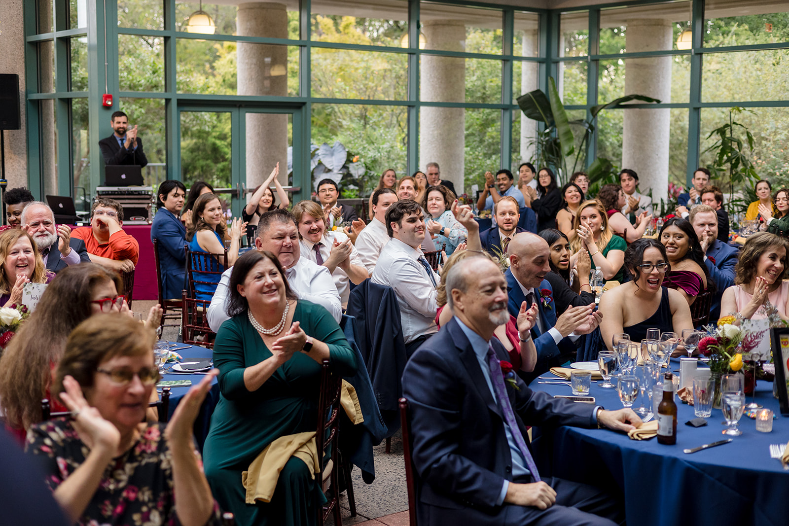 View of guests looking on and clapping at reception