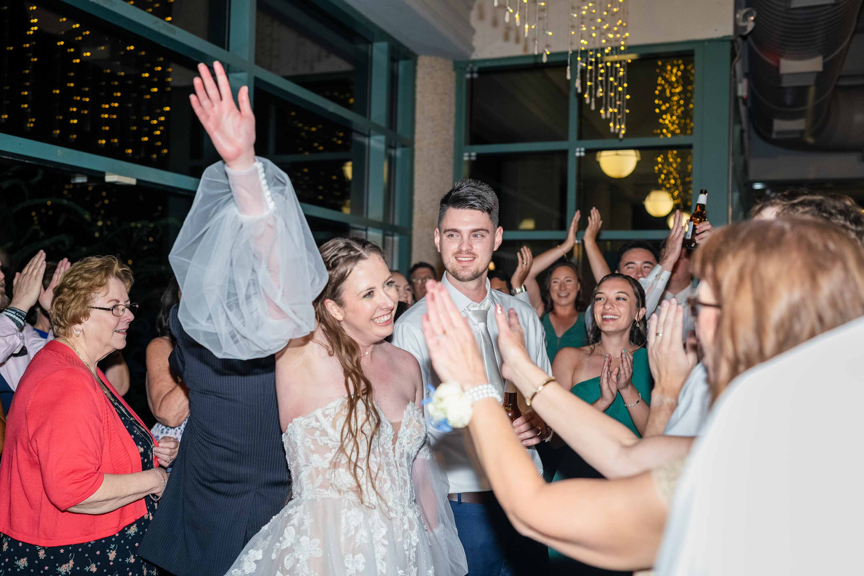 couple on the dance floor with guests