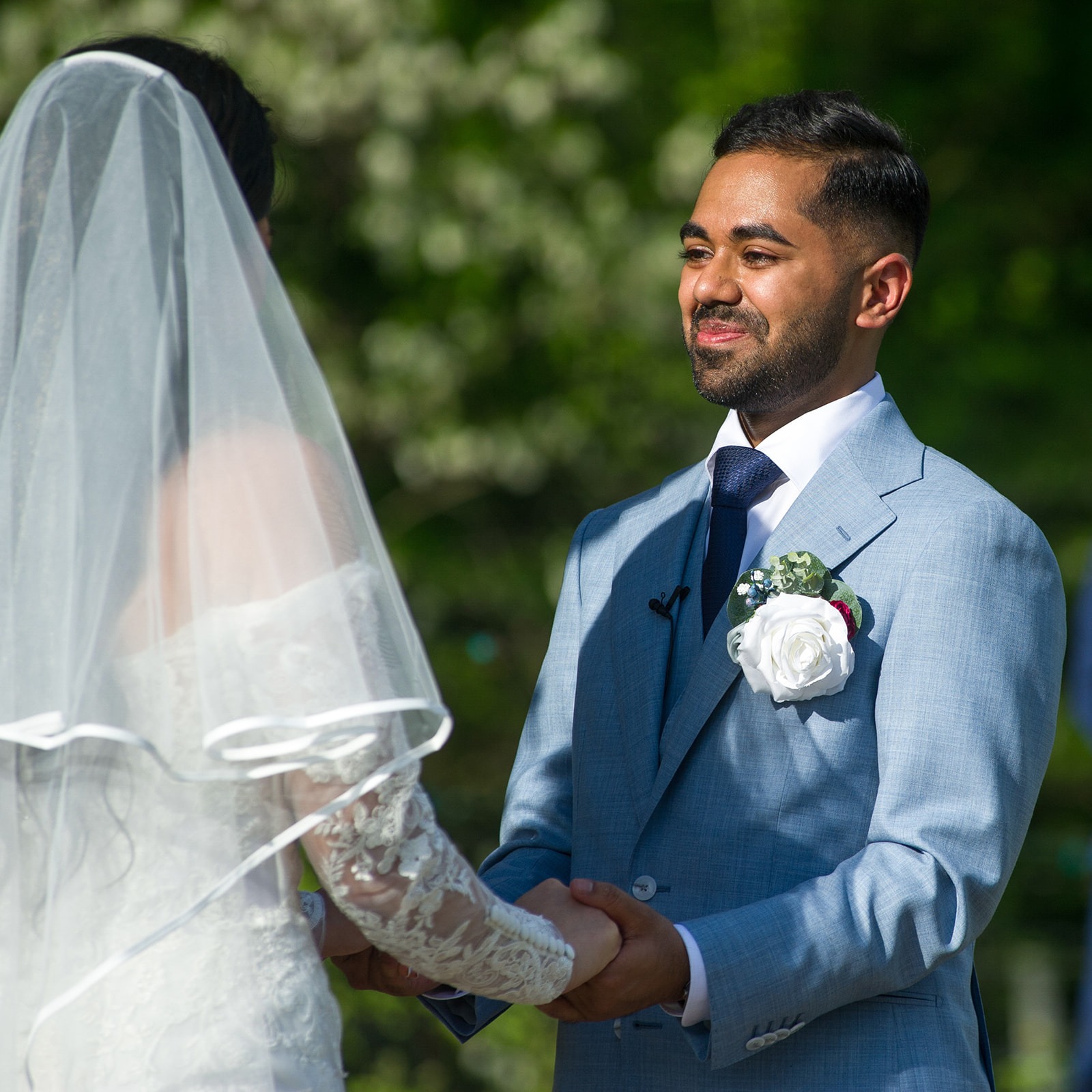 groom starring into brides eyes at the alter